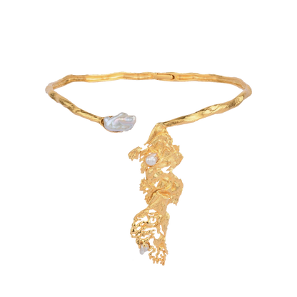 Rhyme Collar handcrafted in recycled brass with a large organic pendant, available in 22K gold or silver rhodium finish, shown against a neutral backdrop